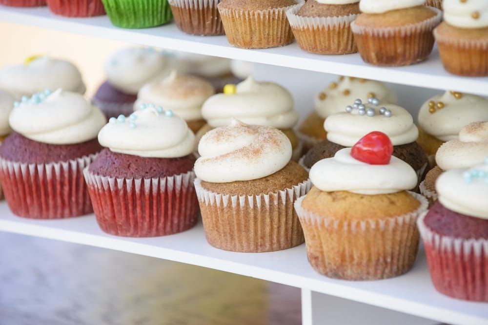assortment of cupcakes on display